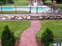 Backyard walkway and elevated pool entrance