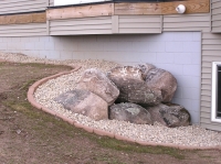 Retaining boulders edged and rocked