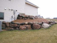 Boulder retaining wall